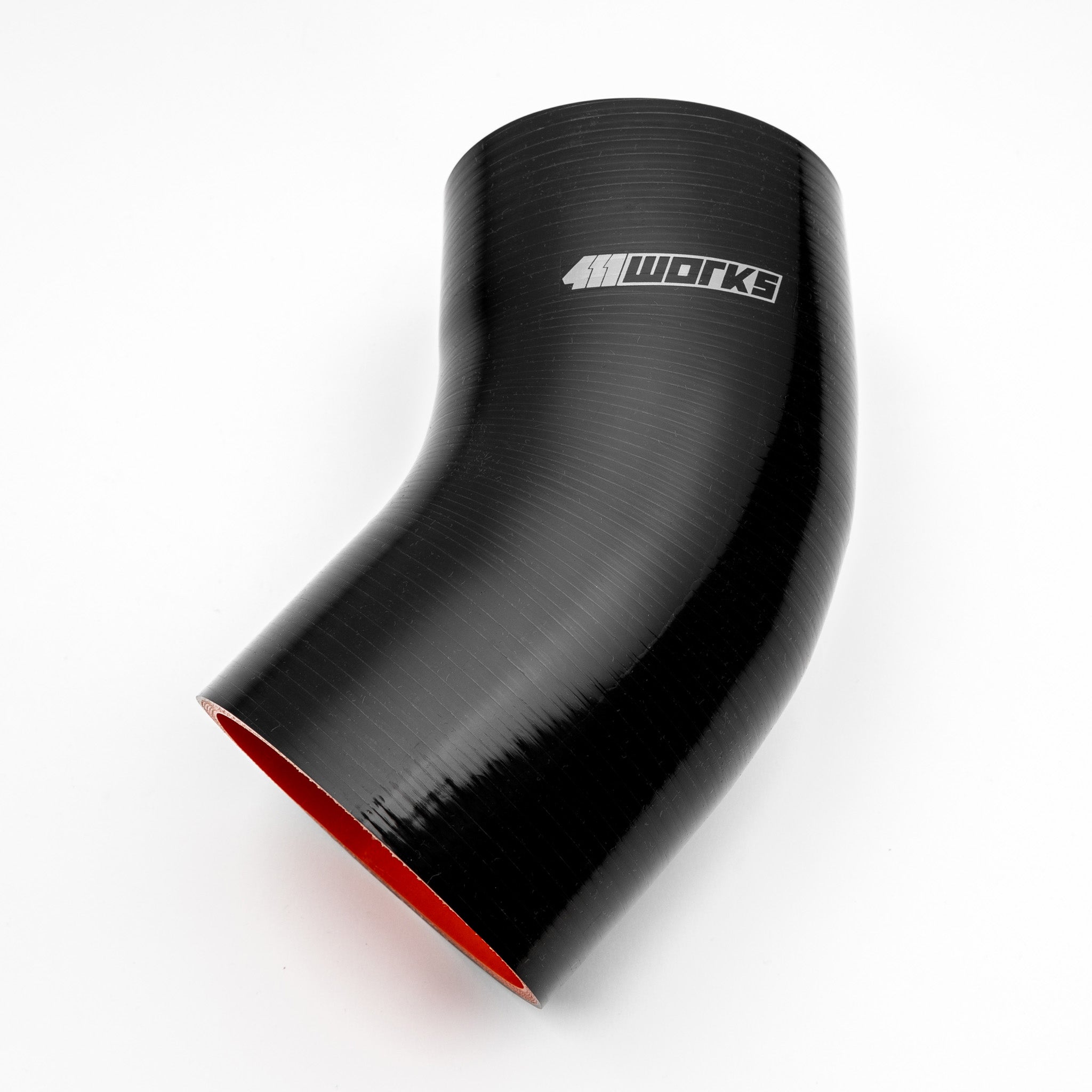 Black silicone hose with red interior on a white background