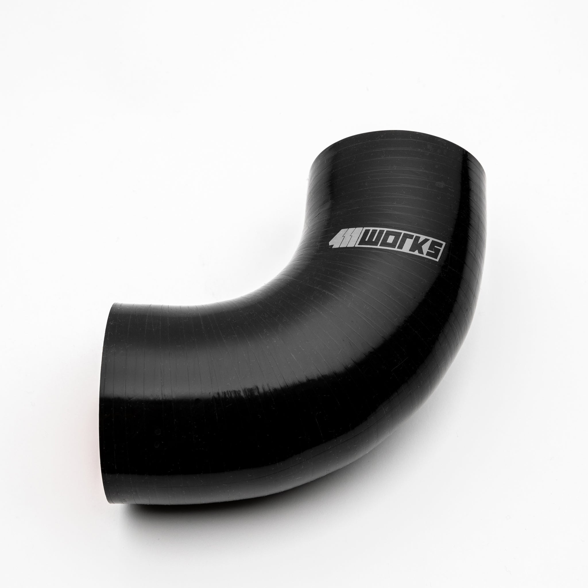 Black silicone hose with '411 Works' branding on a white background
