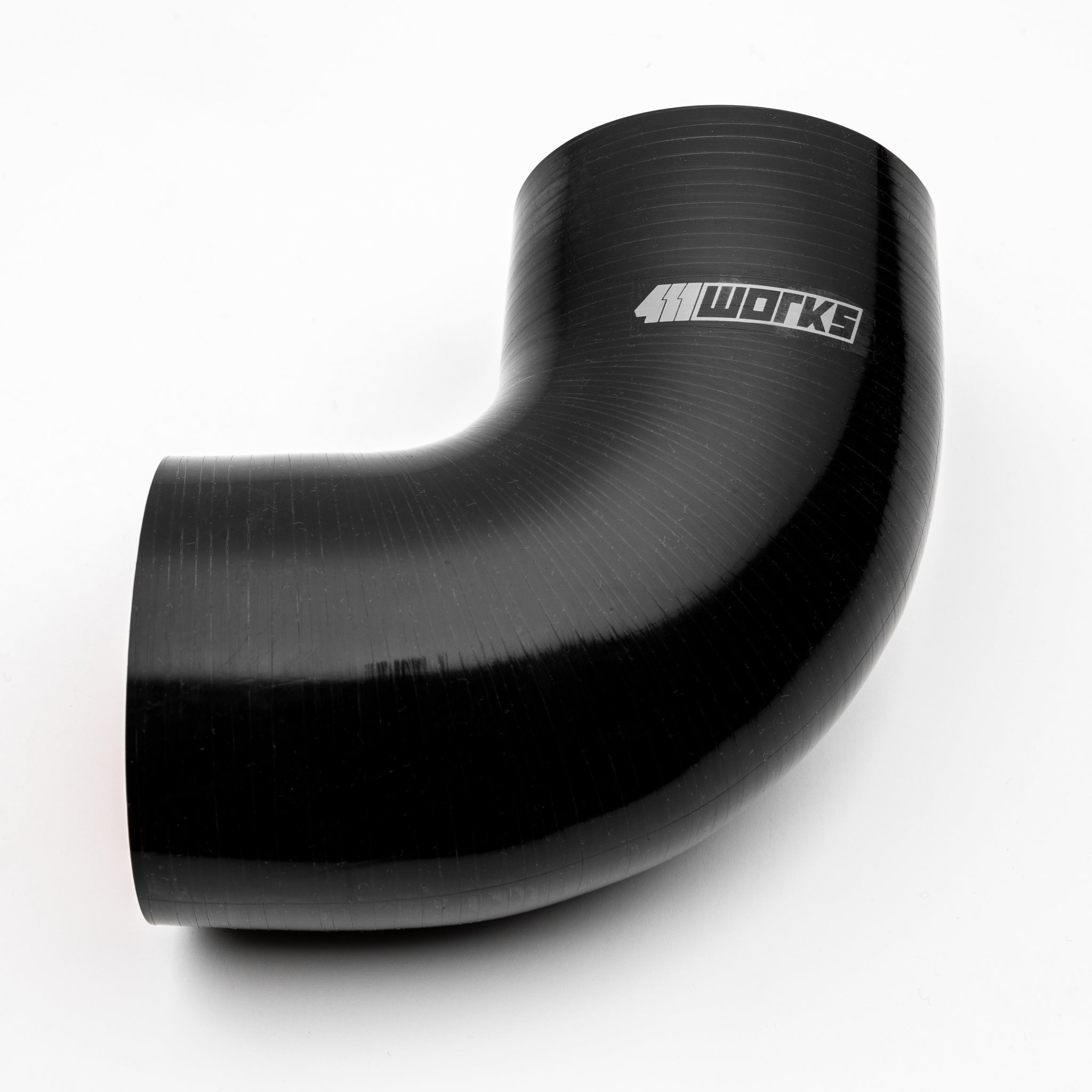 Black silicone hose with '411 Works' branding on a white background