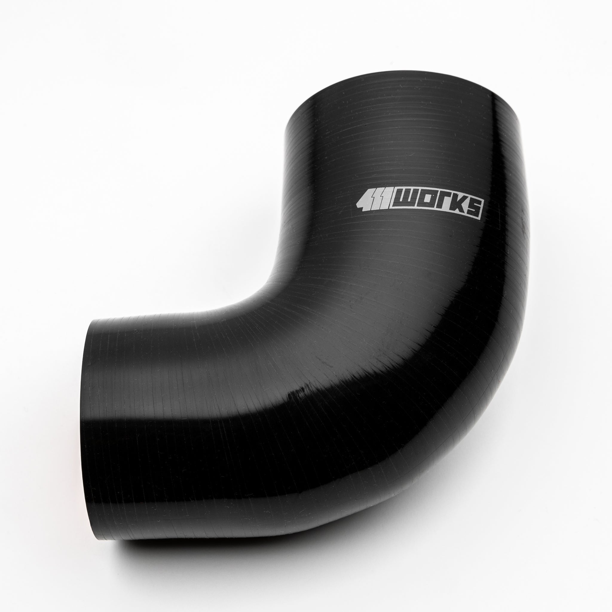 Black silicone hose with '411 Works' logo on a white background