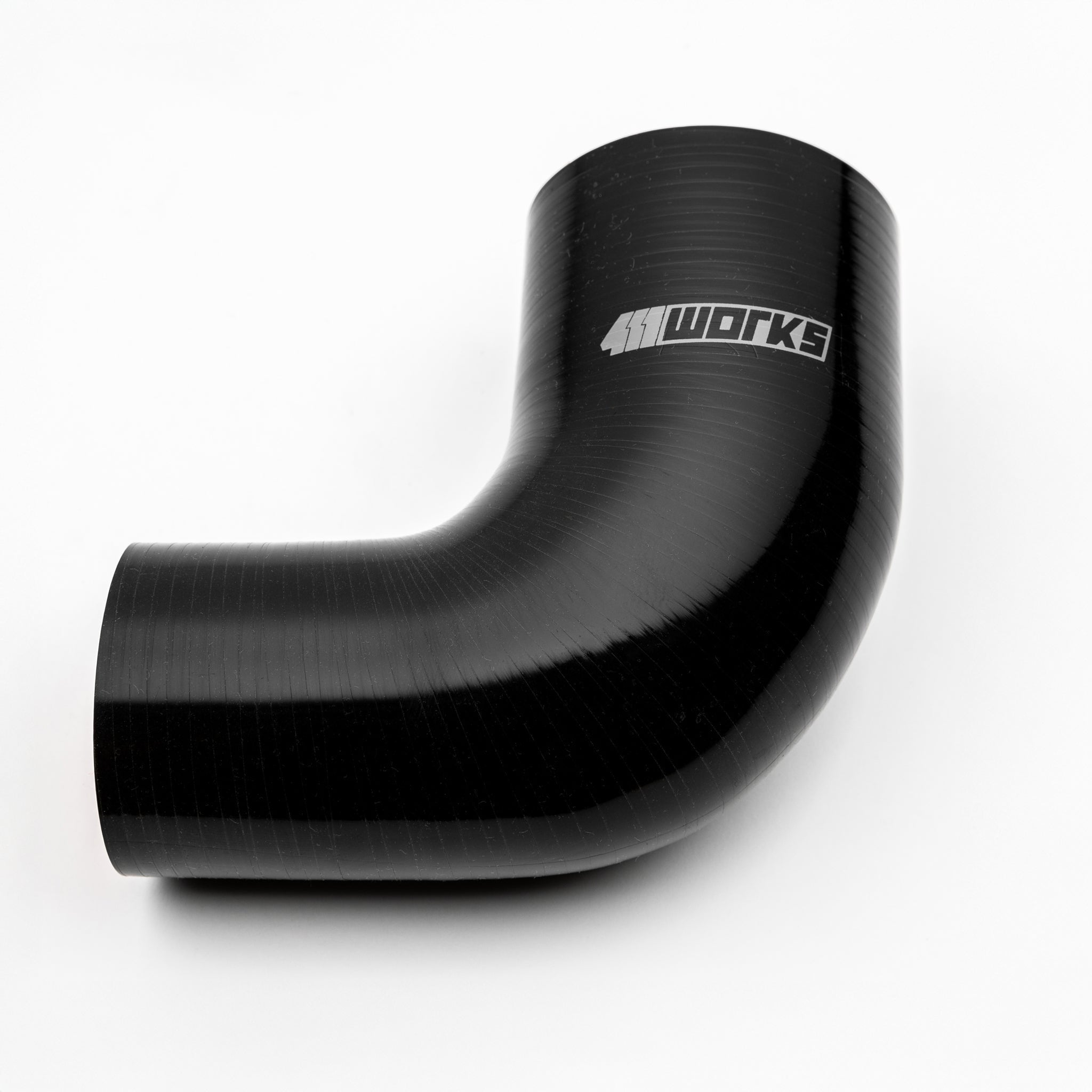Black silicone hose with '411 Works' branding on a white background