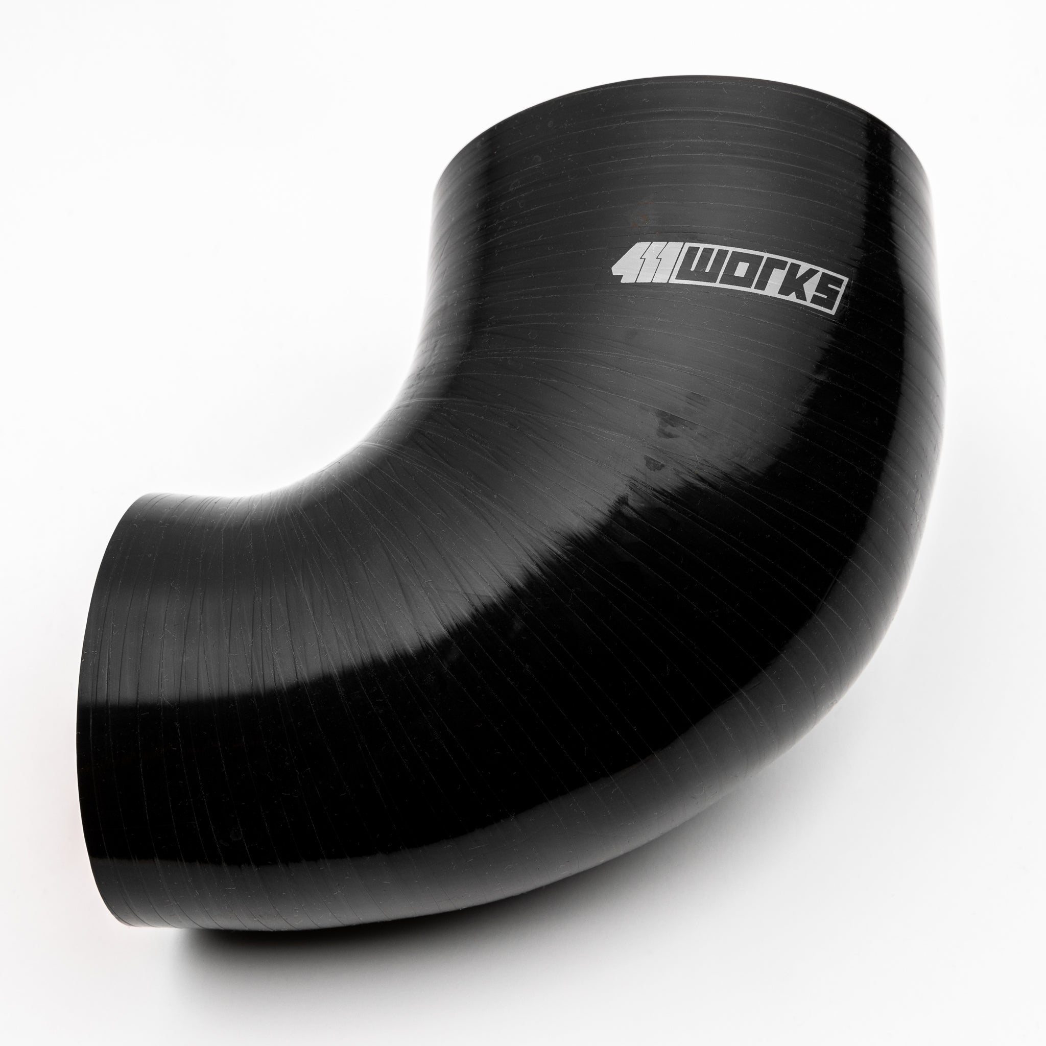 Black silicone hose with '411 Works' branding on a white background
