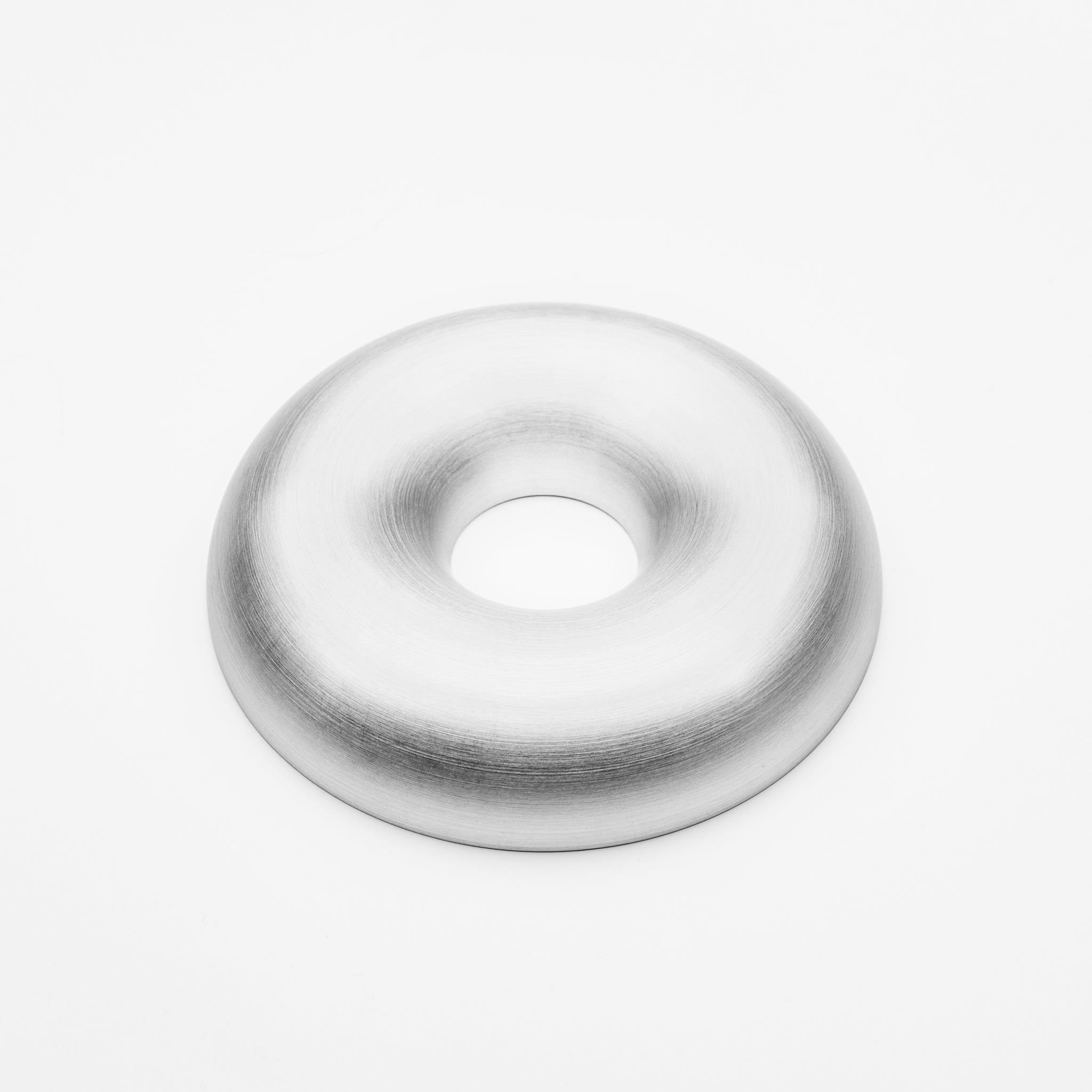 Silver welding donut-shaped object on a white background