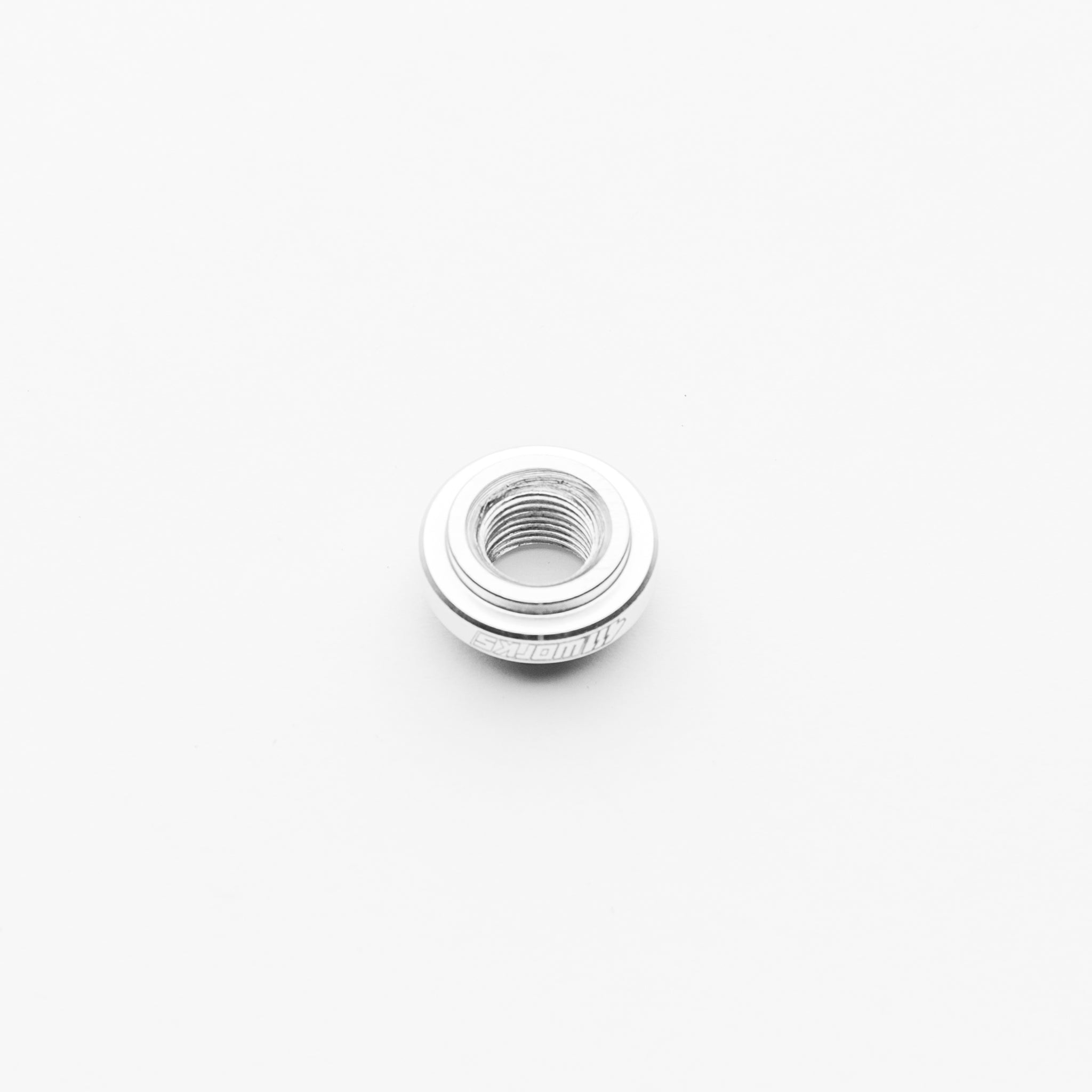 Metallic female bung on a white background