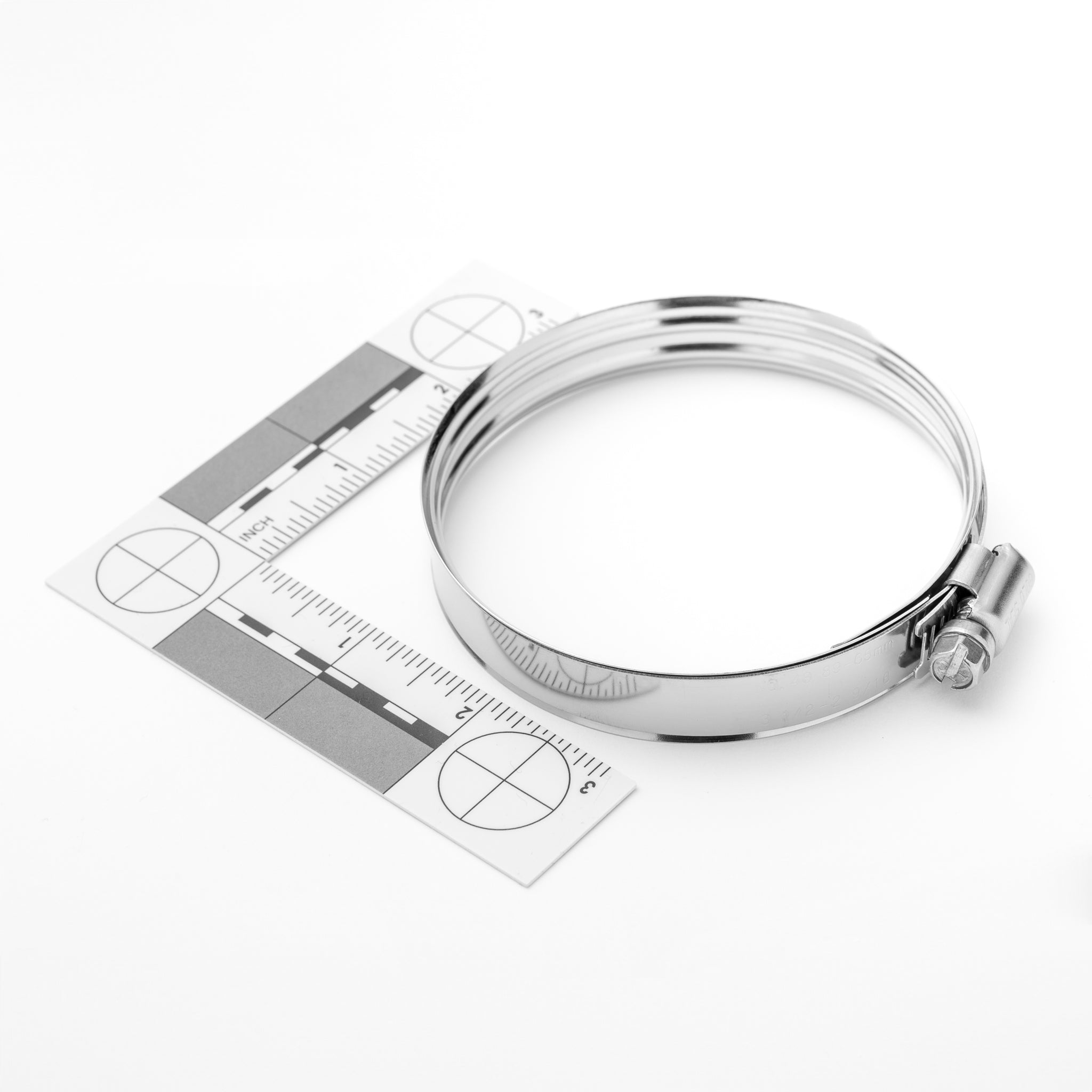 Metallic ring with a ruler on a white background