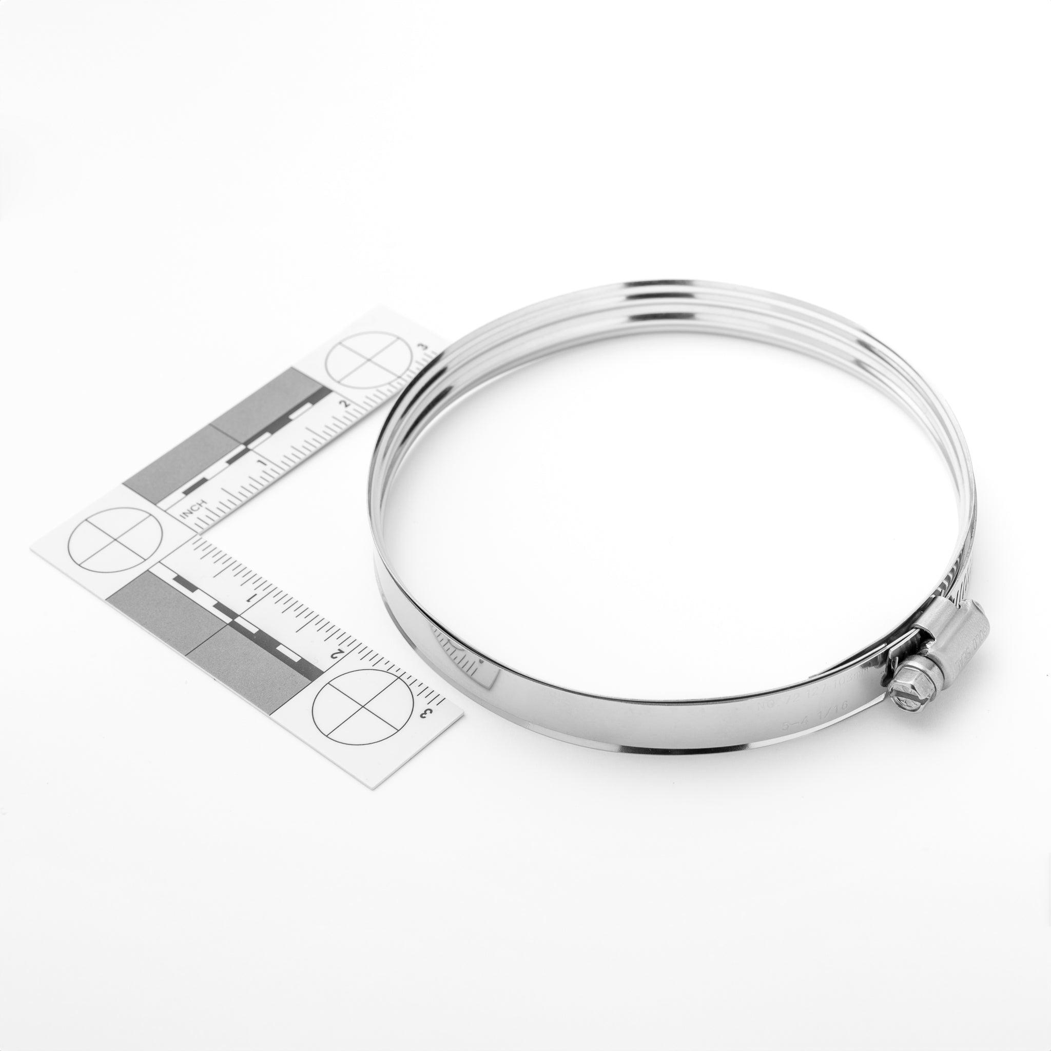 Silver clamp with a ruler on a white background