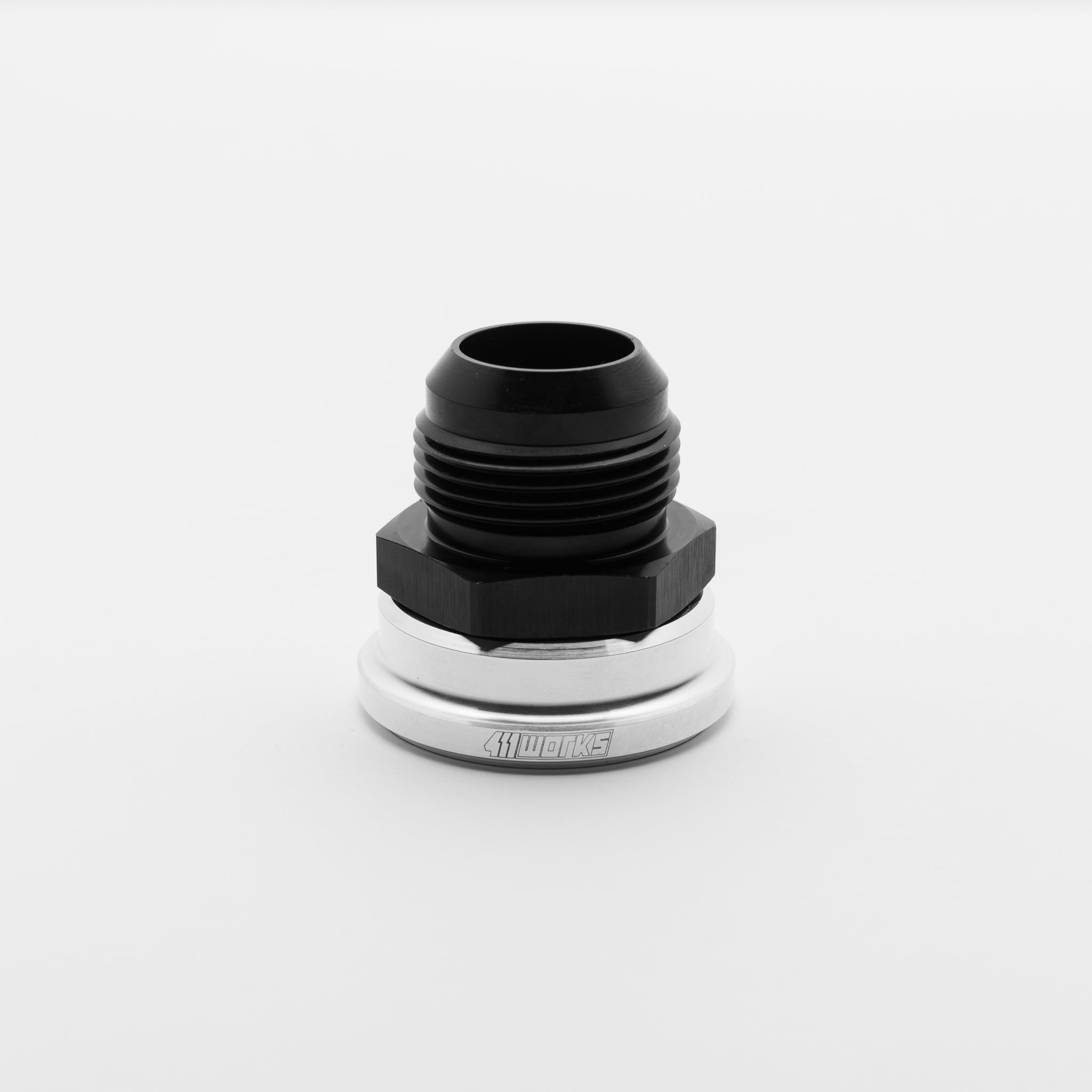 Black and silver metal fitting on a white background