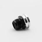 Black and silver metal fitting on a light gray background