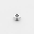 Metallic bung on a light gray background