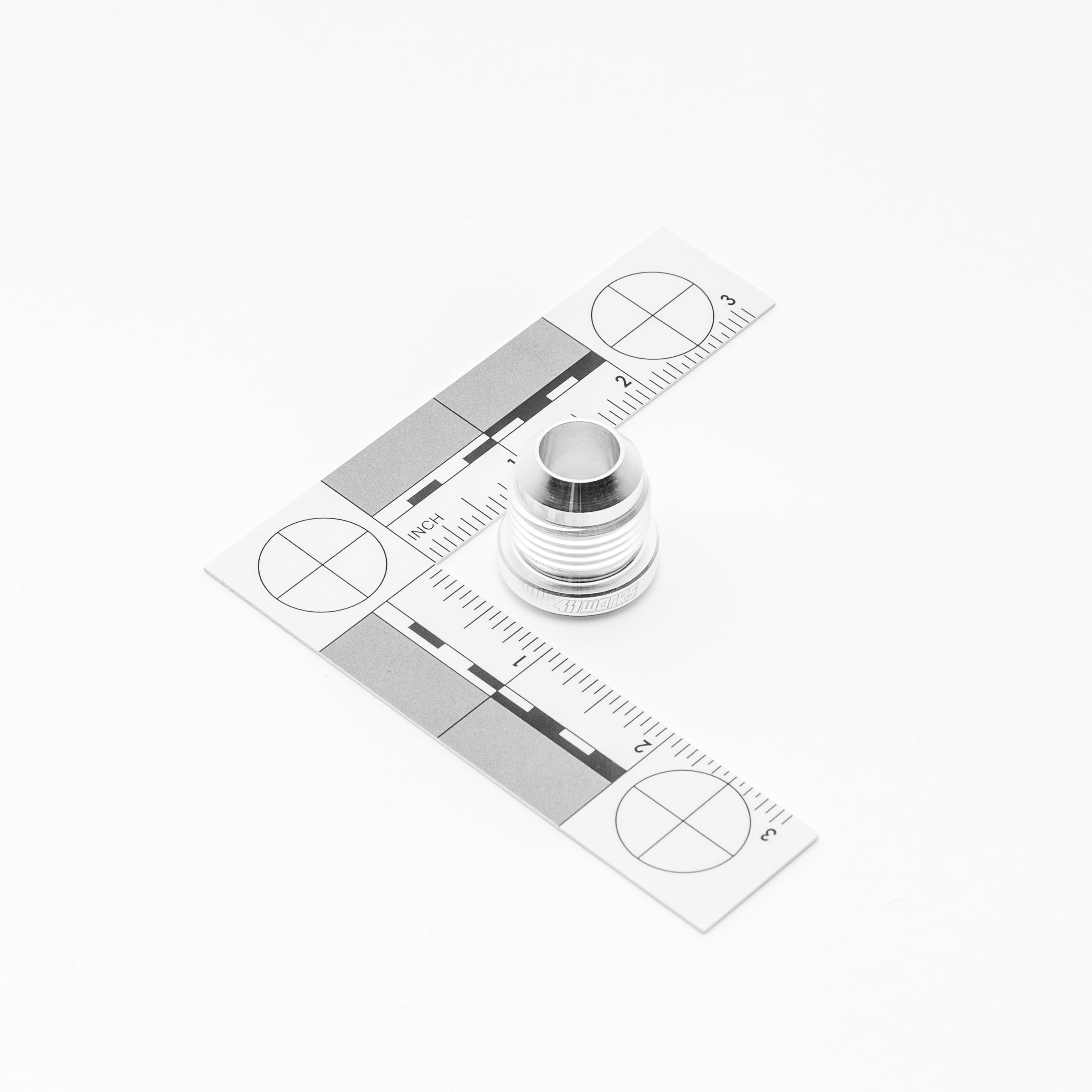 Metal AN fitting with a measurement tool on a white background