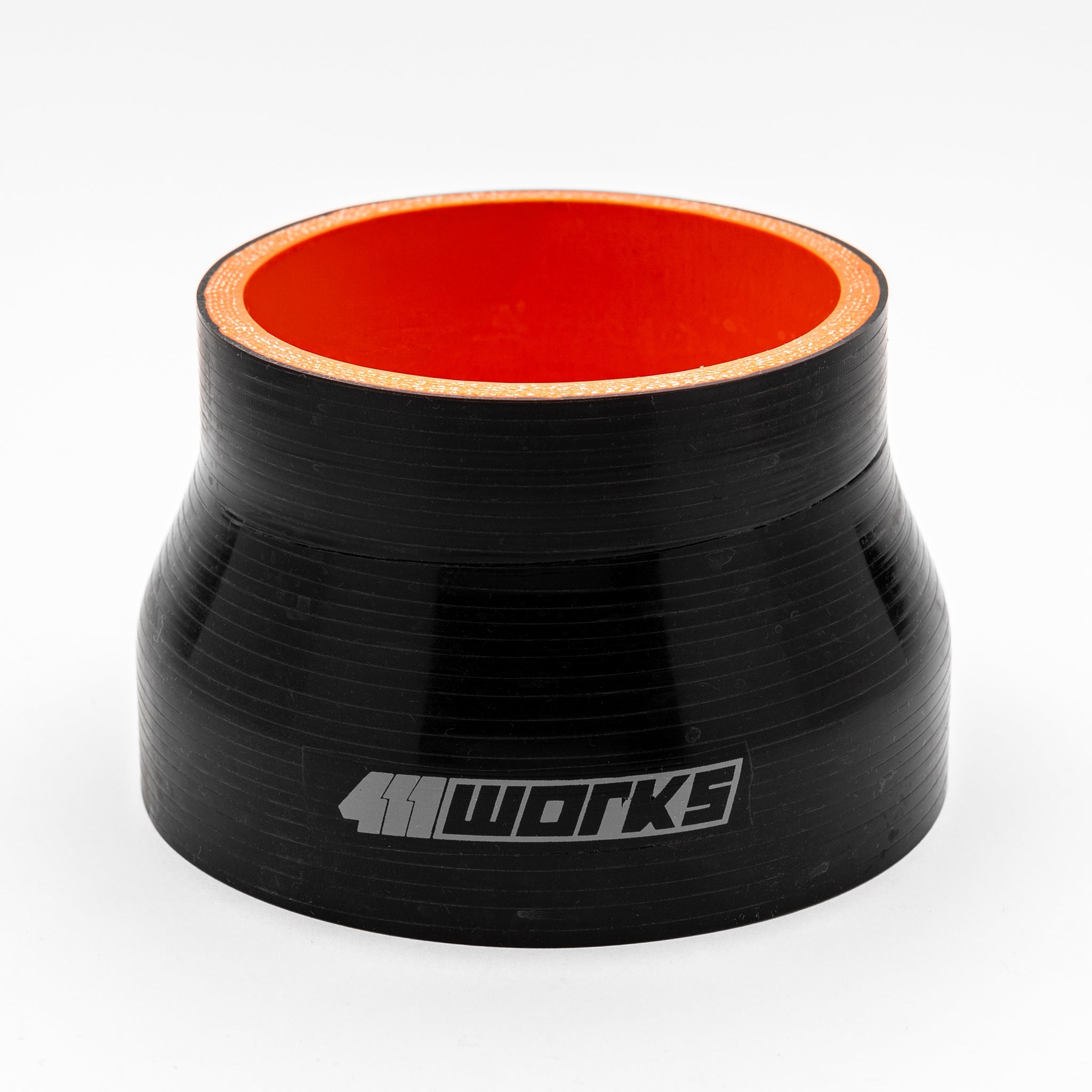 Black silicone hose with red interior on a white background with 411 works logo