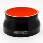 Black silicone hose with orange interior on a white background