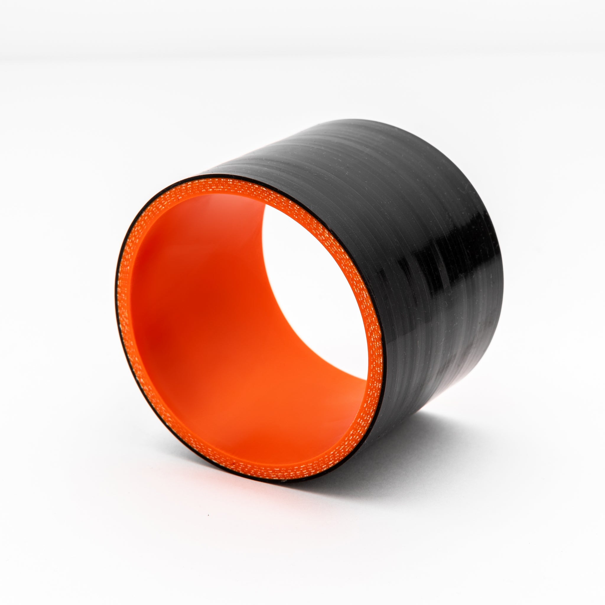 Black and orange coupler object on a white background