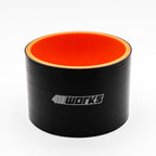 Black silicone hose with orange interior on a white background