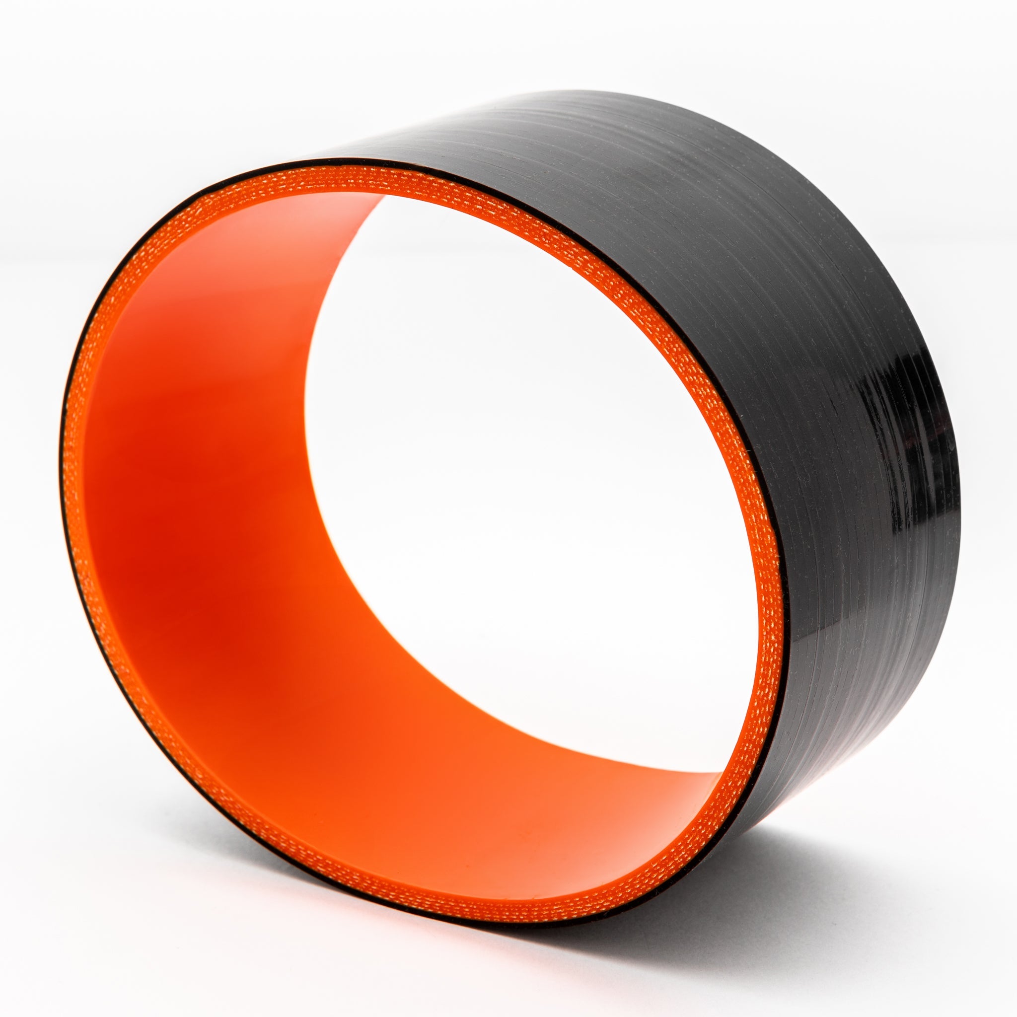 Black and red cylindrical coupler on a white background