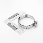 Metallic hose clamp on a white background with measurement ruler