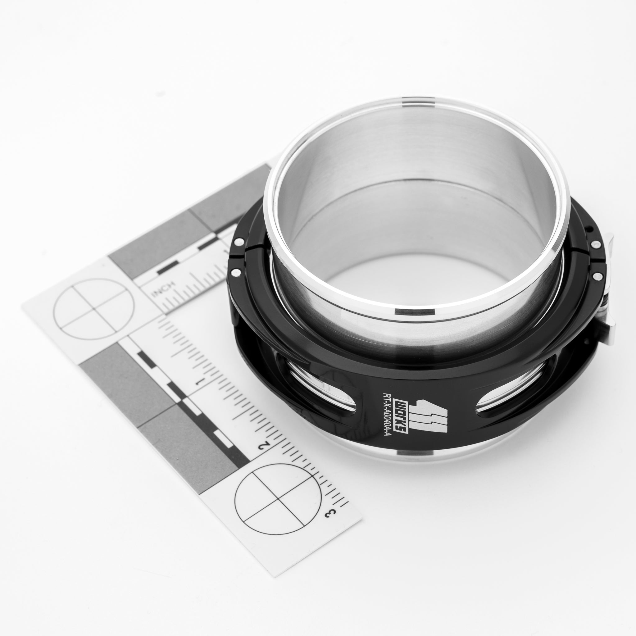 Metal reducer ferrule with a ruler for measurement on a white background
