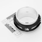 White and black clamp reducer with measurement scale on a white background