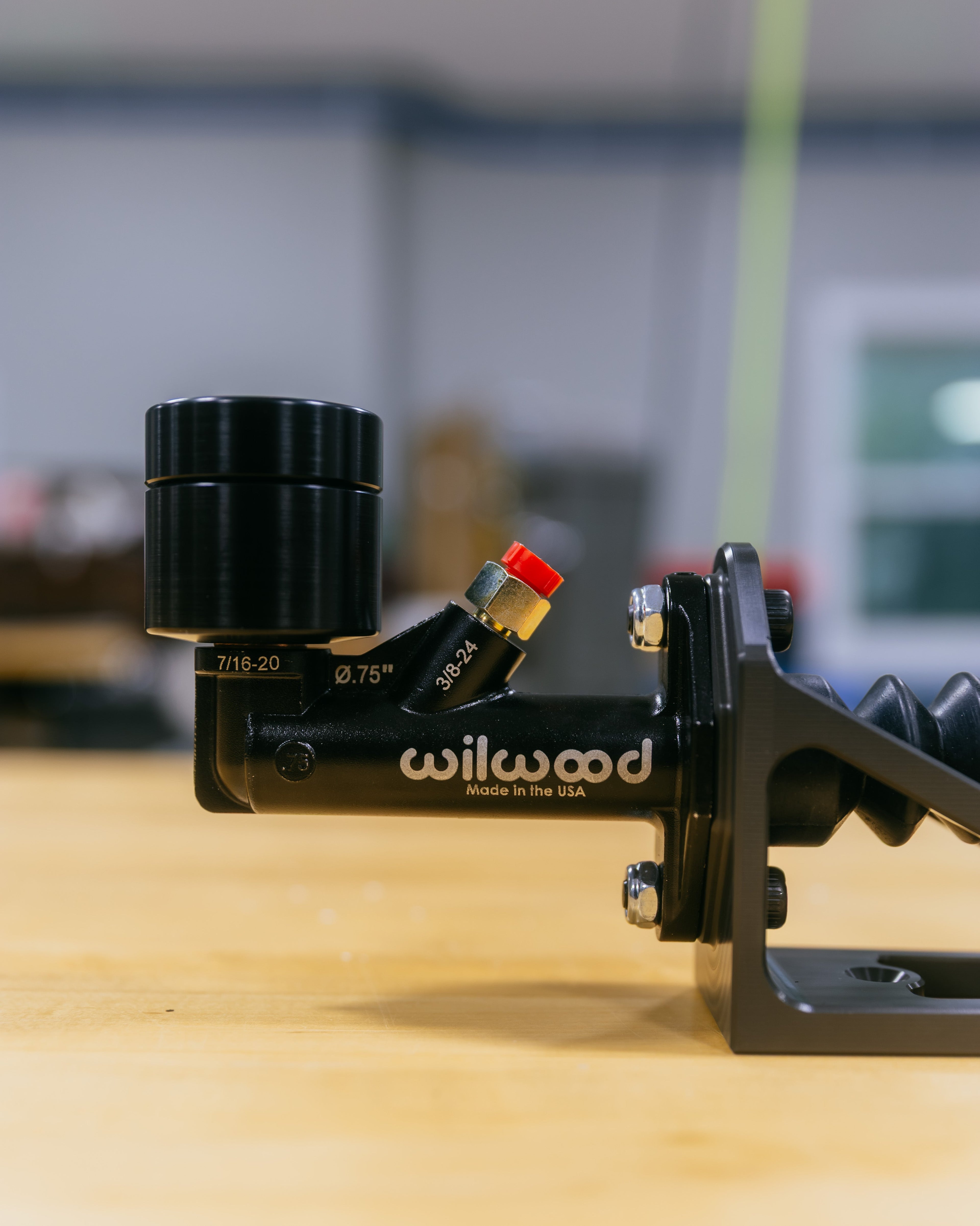 Close-up of a Wilwood brake setup on a blurred background