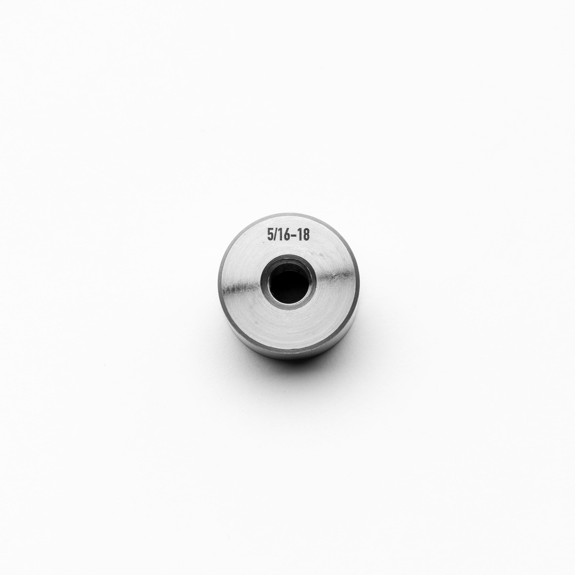 Steel weld bungs with measurement '5/16-18' on a white background
