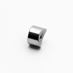 Metallic cylindrical object on a white background