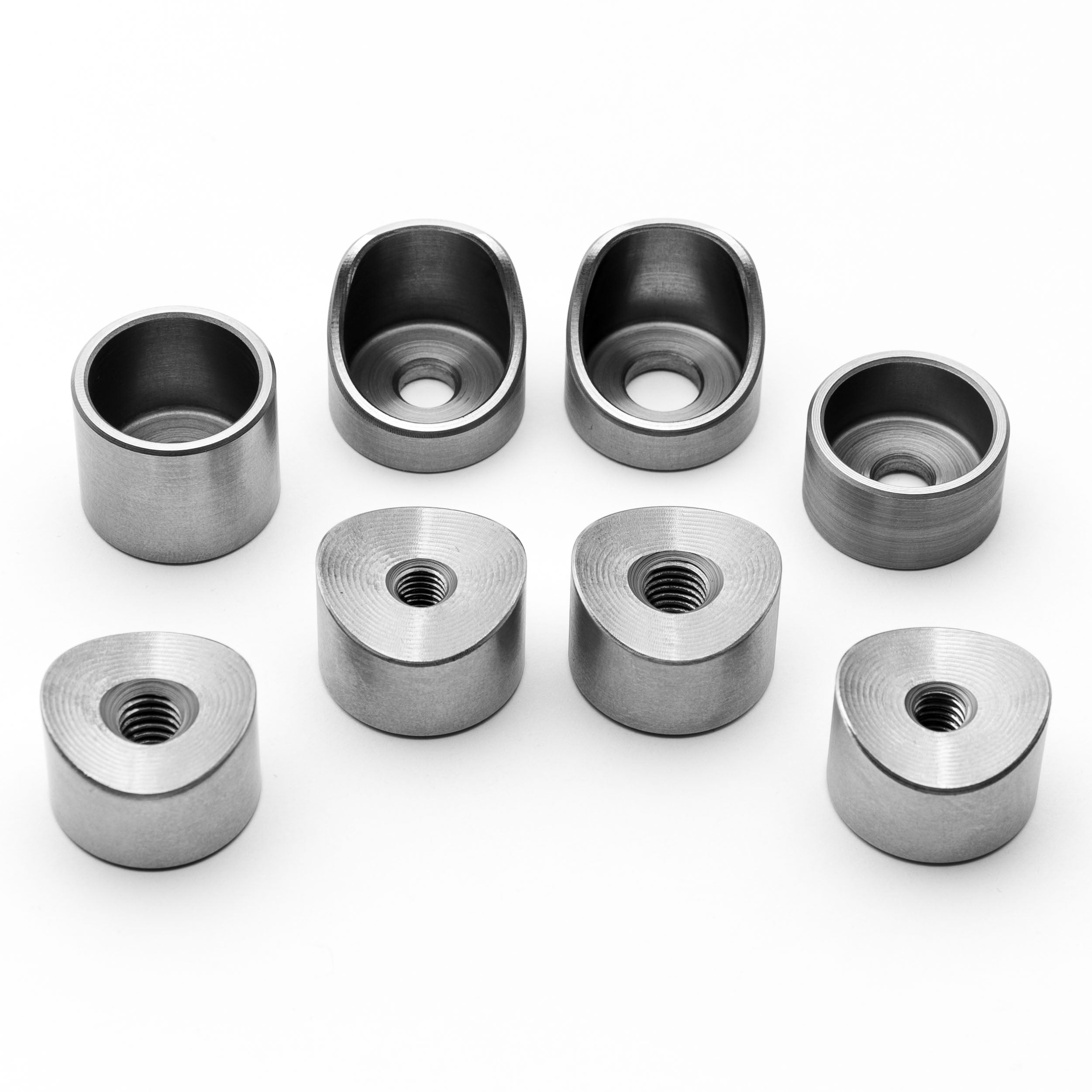 Set of coped weld bungs on a white background