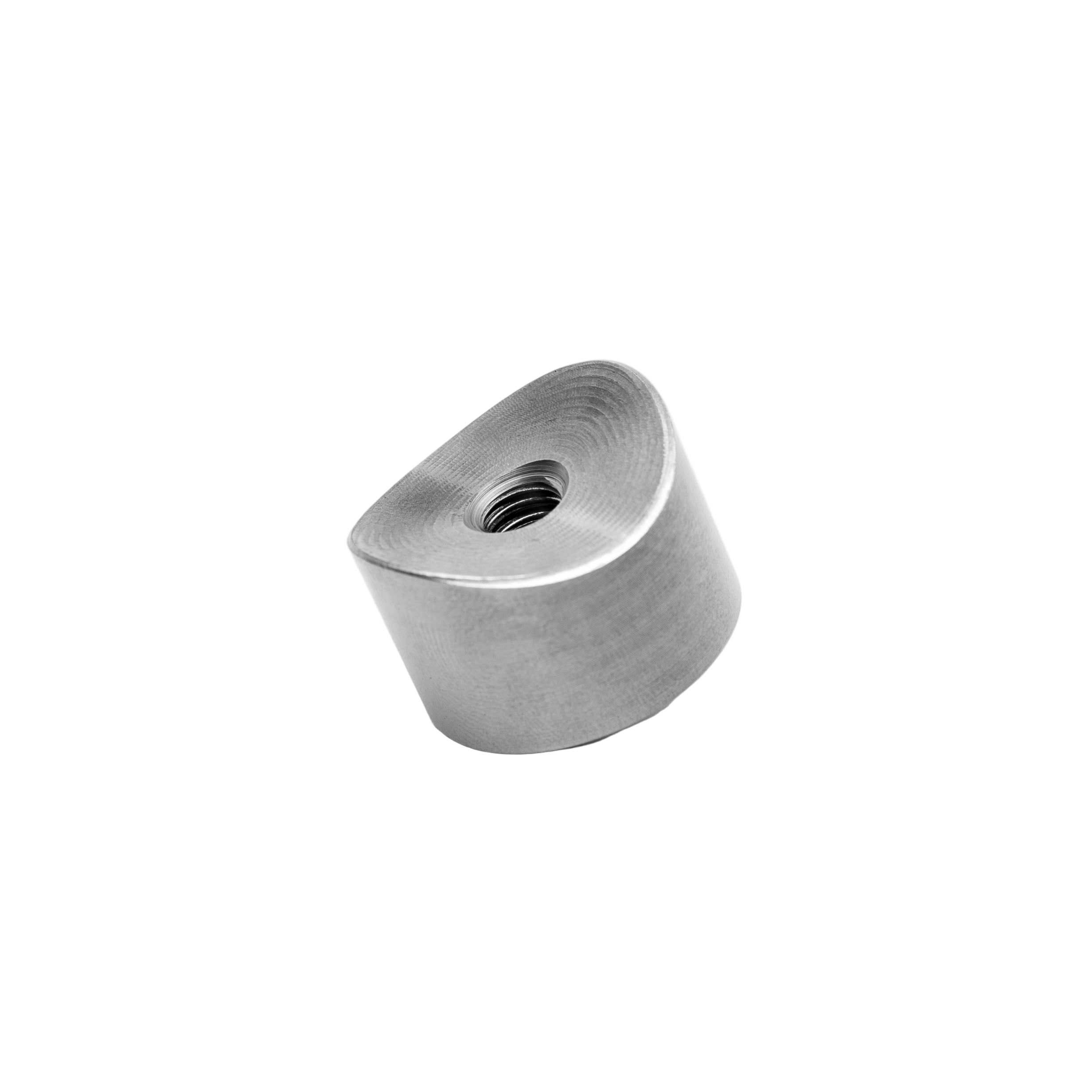 Metallic weld bung on a white background
