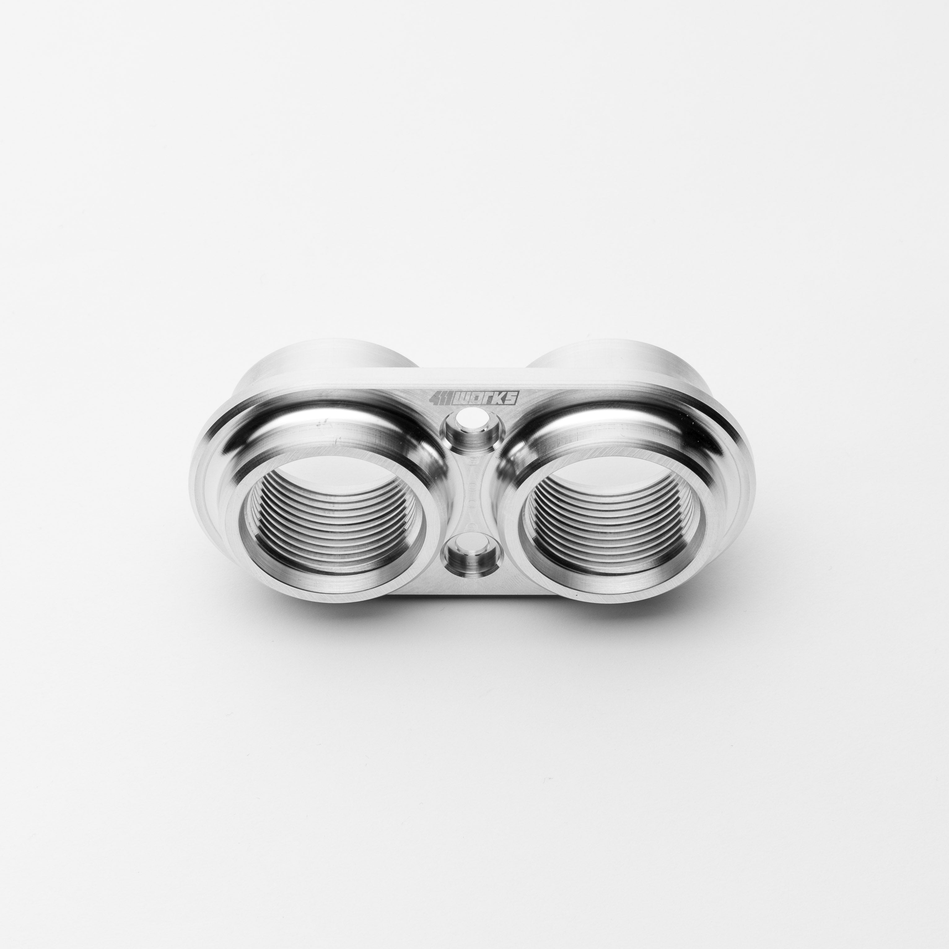 Metallic bulkhead screw on a white background