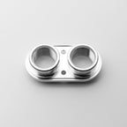 Metallic bulk head gasket on a light gray background