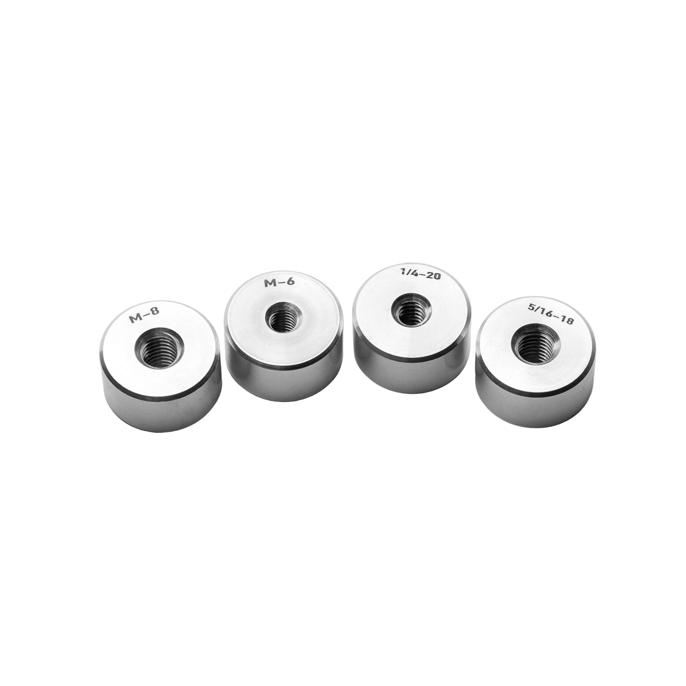 Thread bungs with different thread sizes on a light gray background