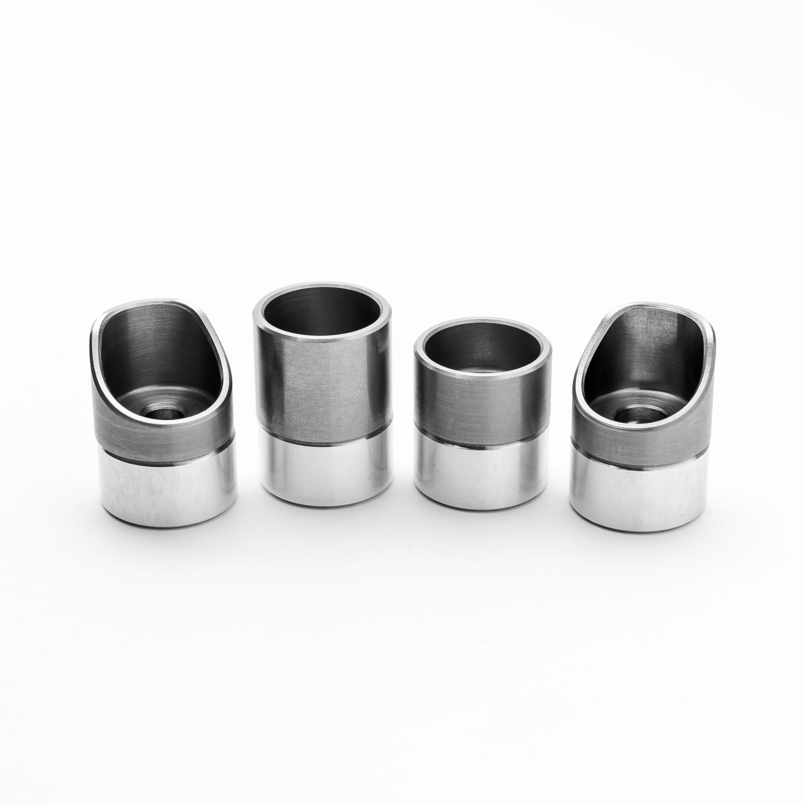 Four metallic cups on a white background