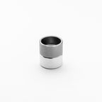 Metallic cylindrical object with gradient color on a white background