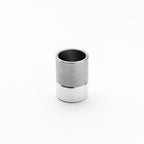 Silver and black cylindrical object on a white background