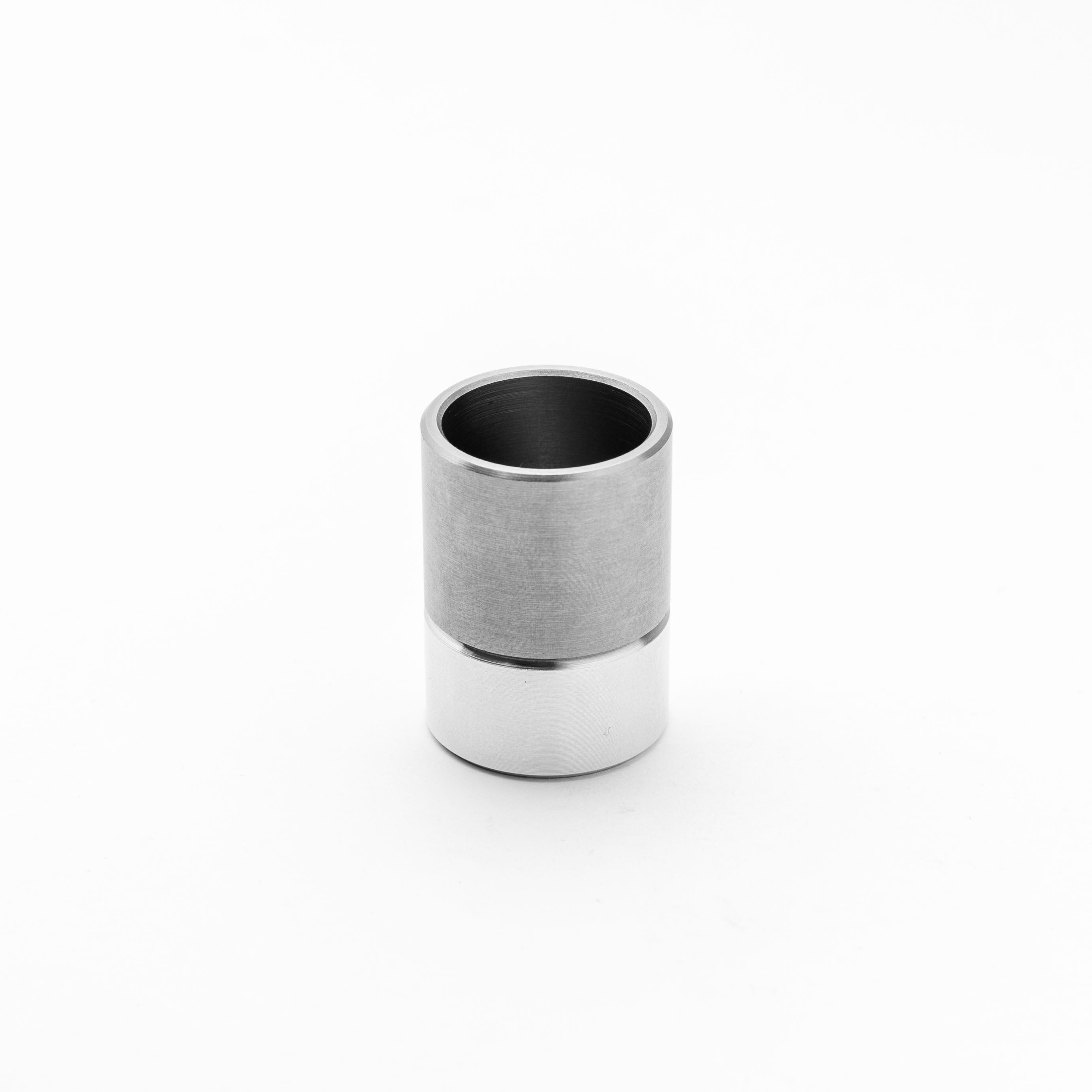Silver and black cylindrical object on a white background