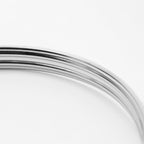 Close-up of a metallic piece on a white background