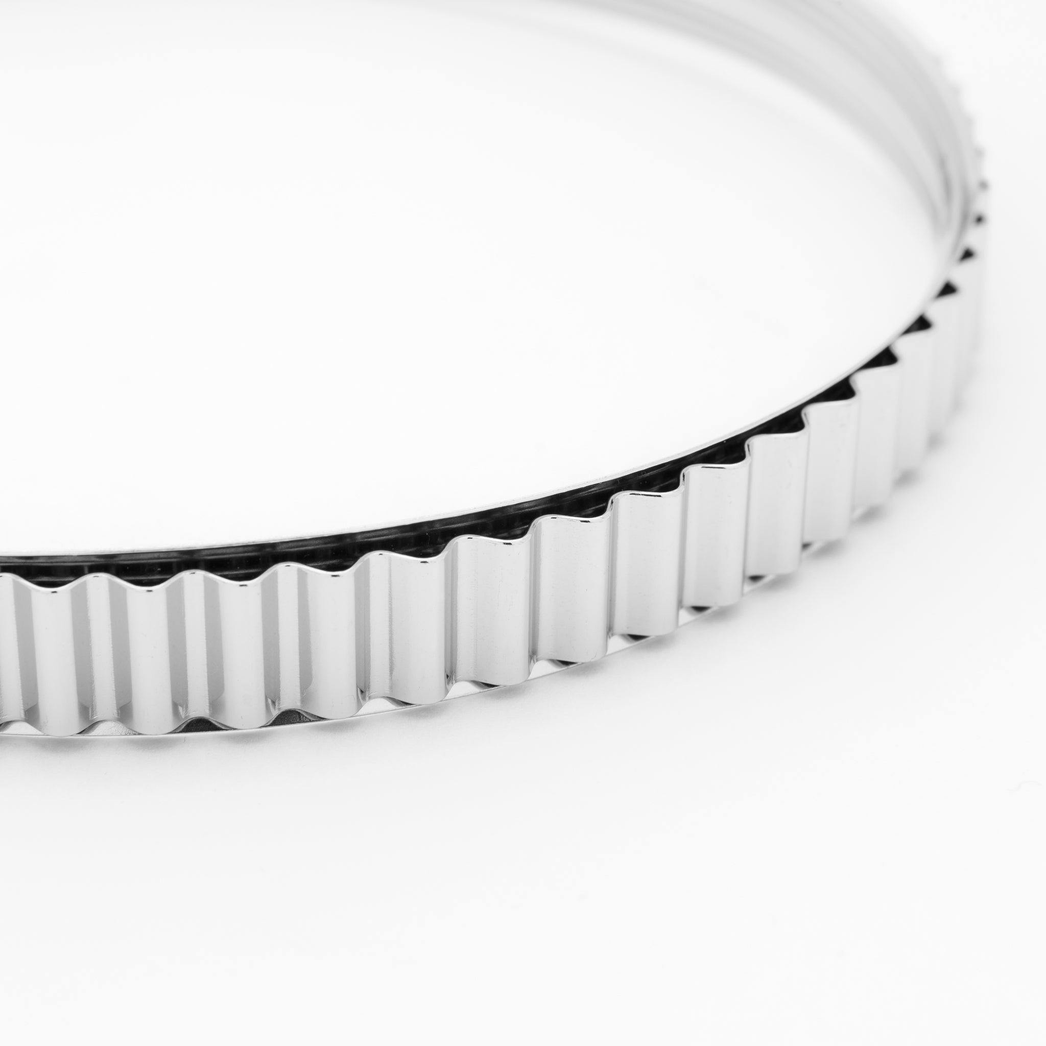 Close-up of a silver clamp on a white background