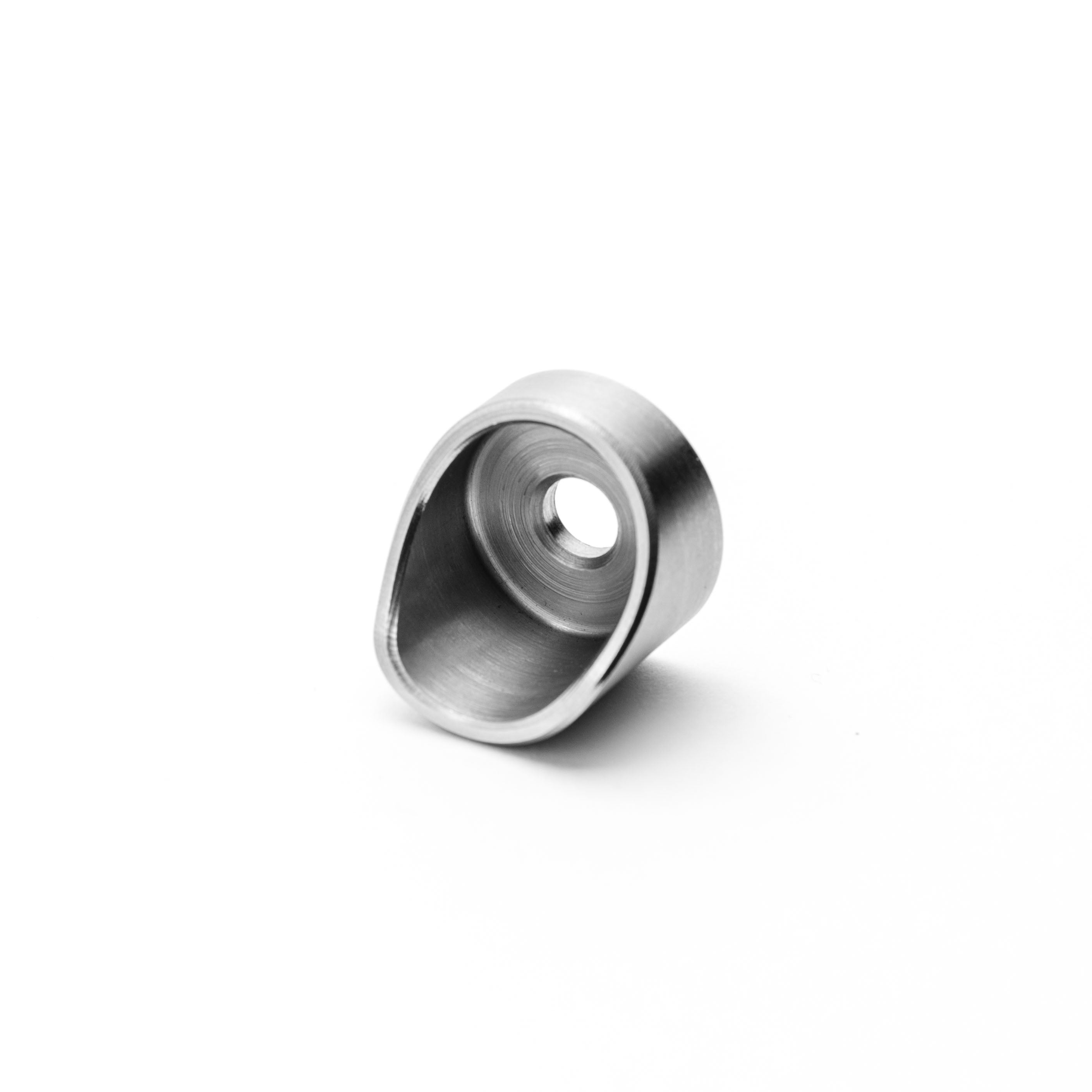 Metallic ring with a central hole on a white background