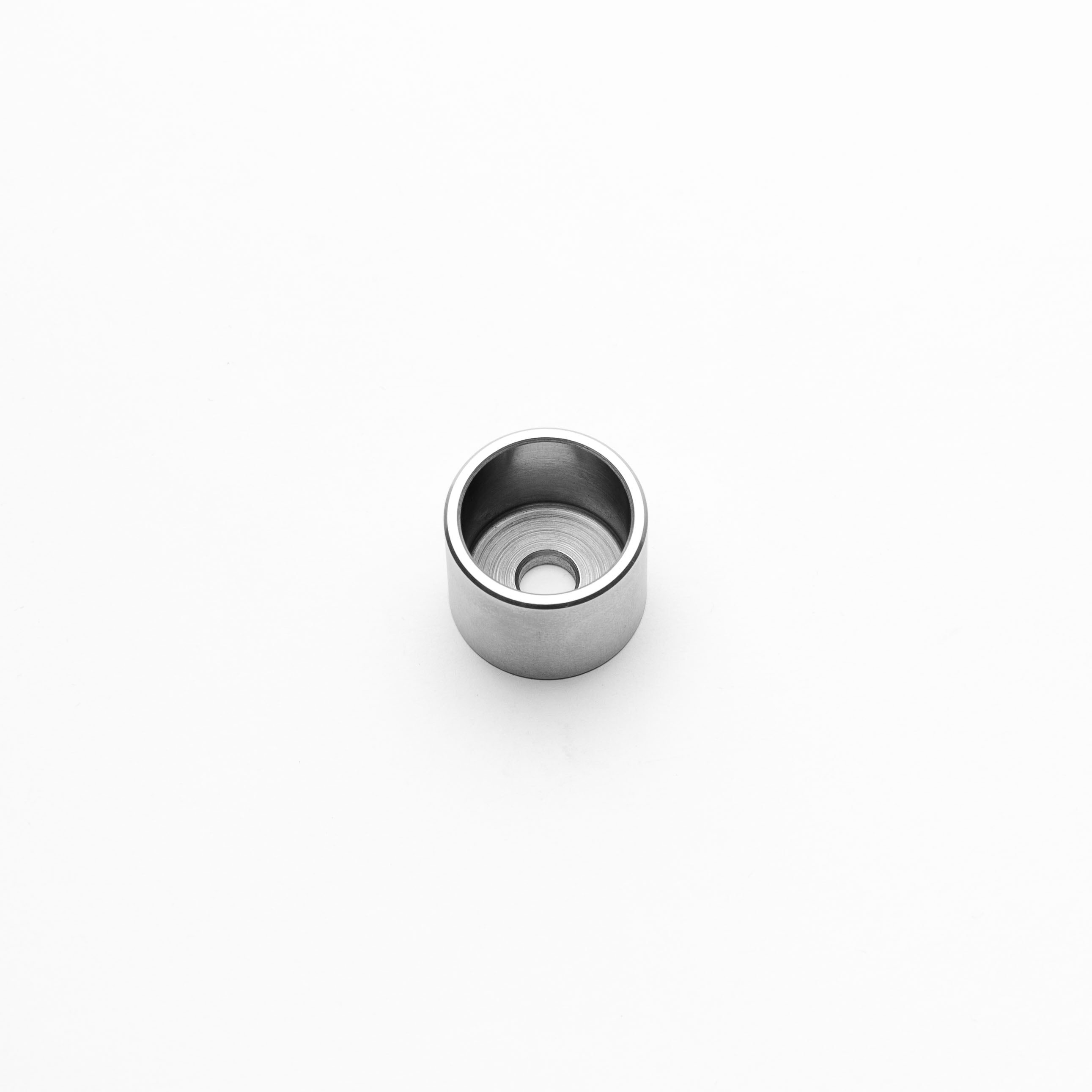 Metallic weld cup on a white background