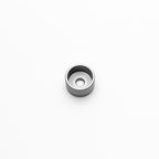 Metallic M6 shallow weld on a white background