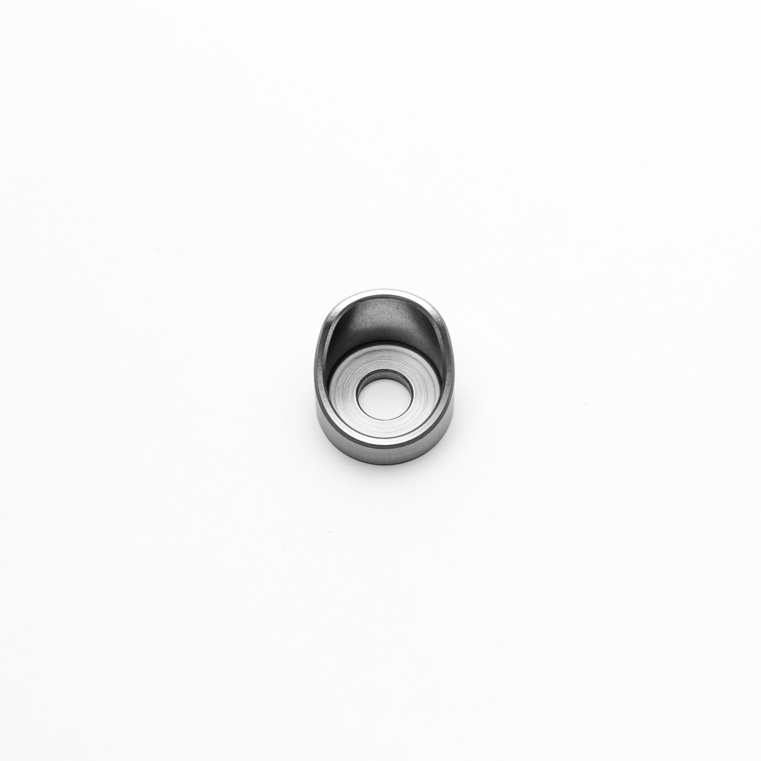 Metallic ring with a central hole on a white background