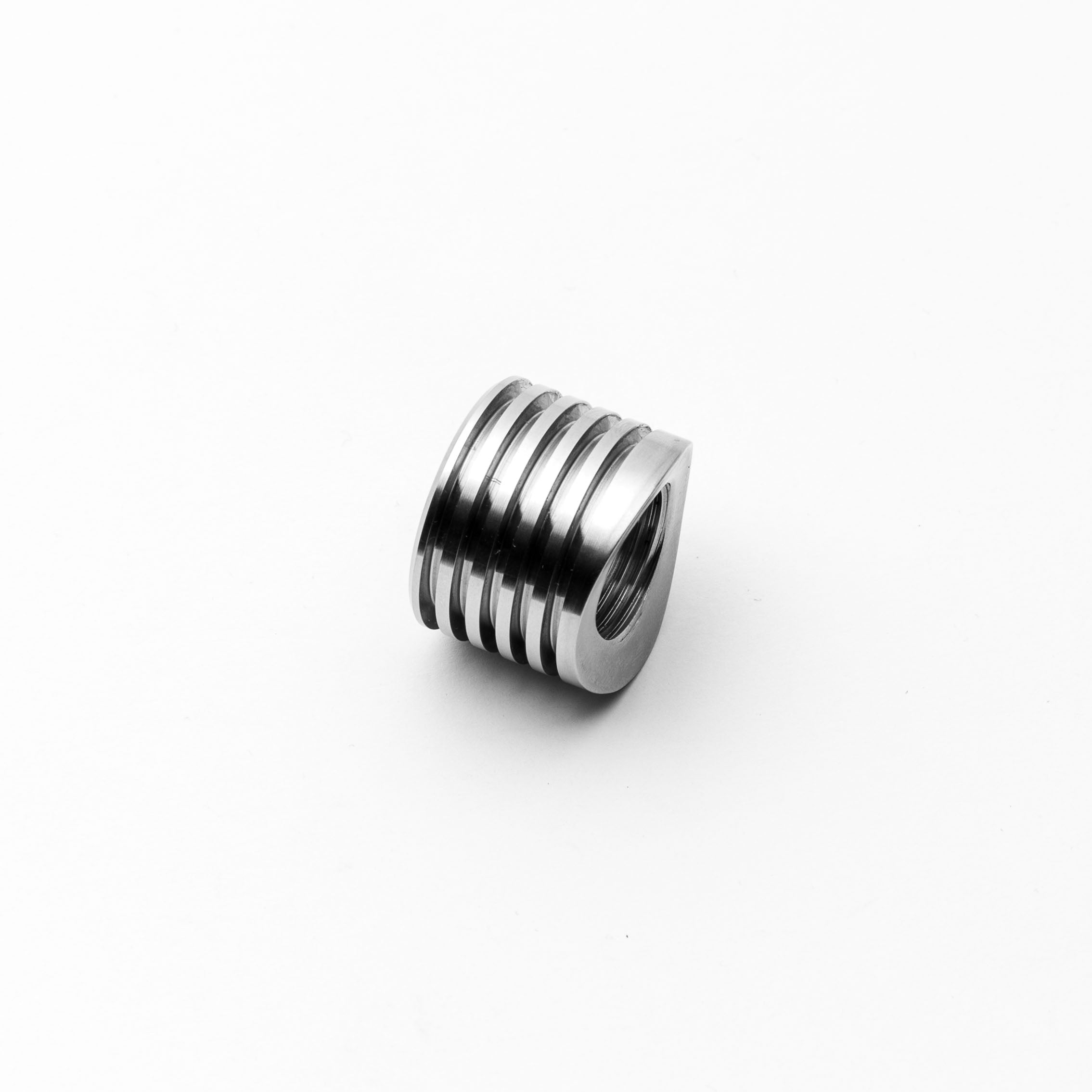 02 Bung heat sunk component with grooves on a white background