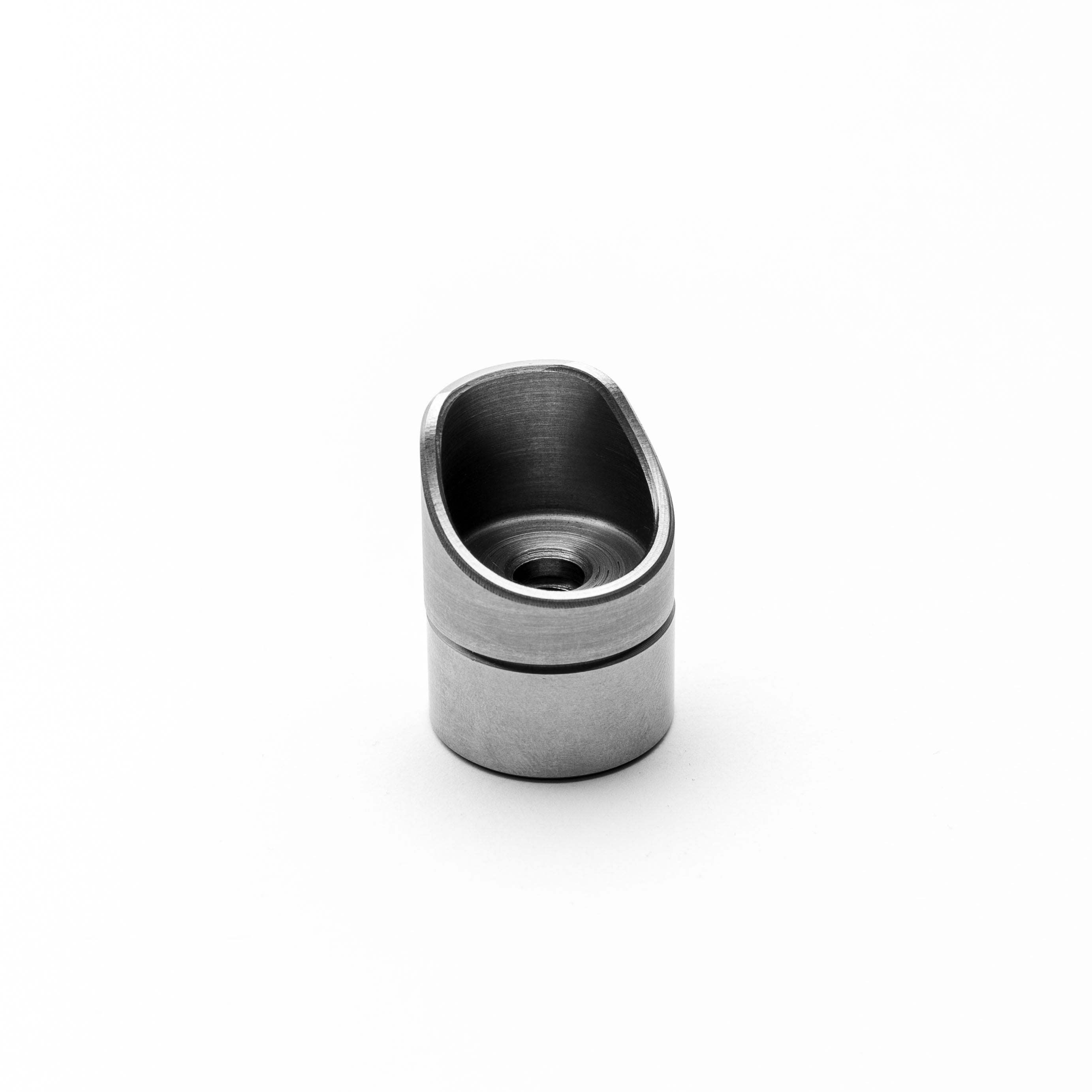 Metallic steel threaded bungs on a white background