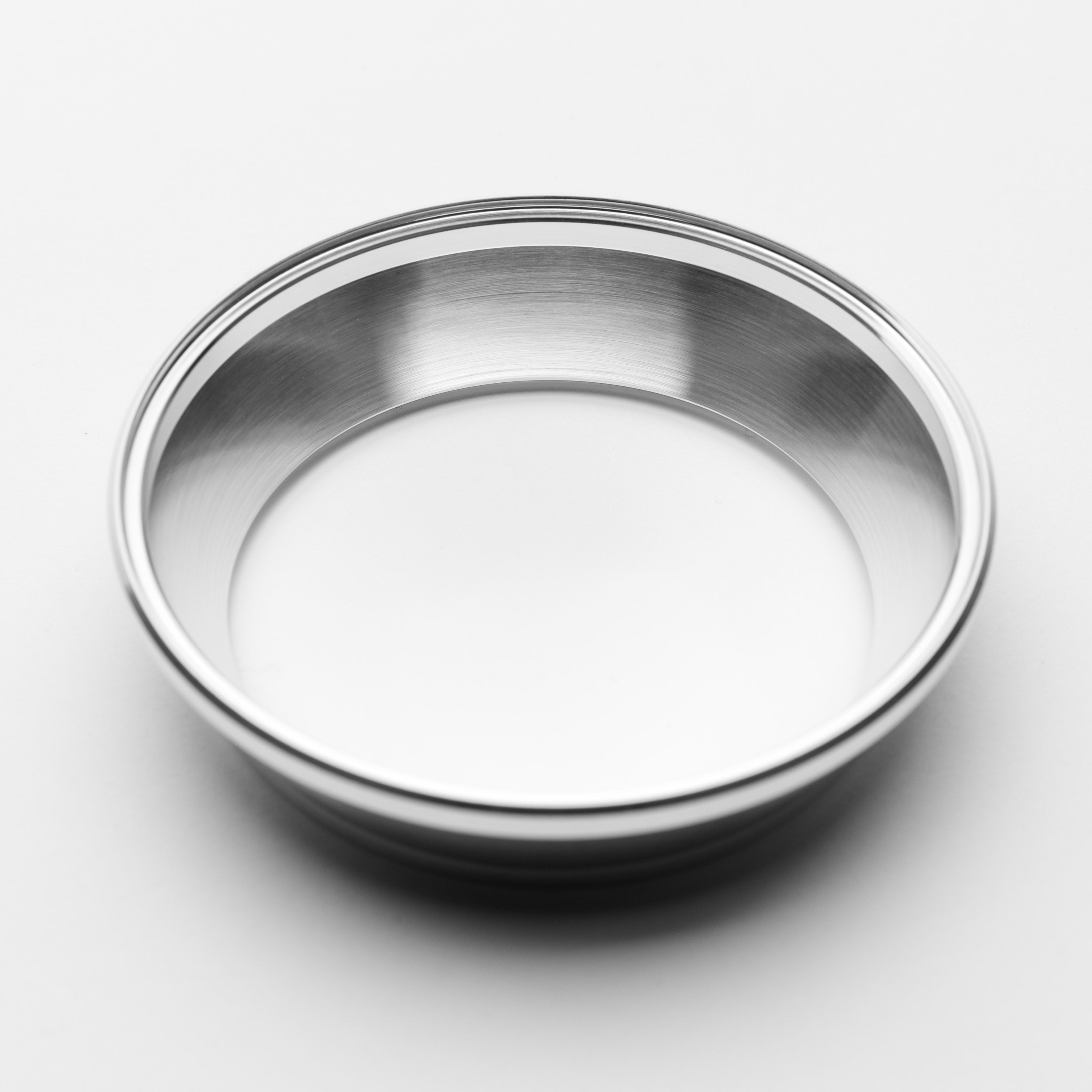 Stainless steel bowl on a white background
