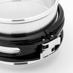 Close-up of a metallic clamp on a white background