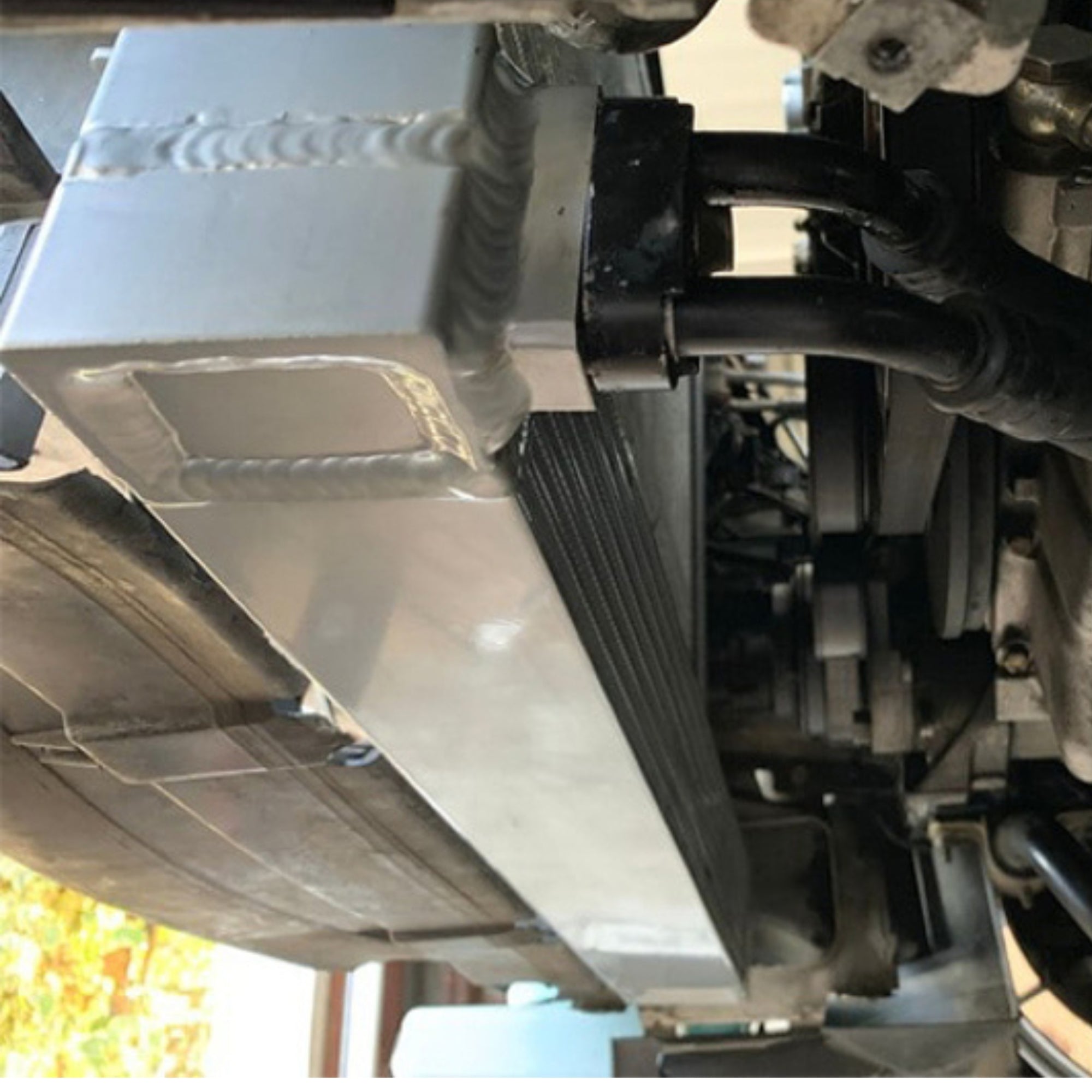 BMW csf race spec dual pass oil cooler installed under car