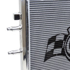 Close-up of a radiator with a brand logo on a white background