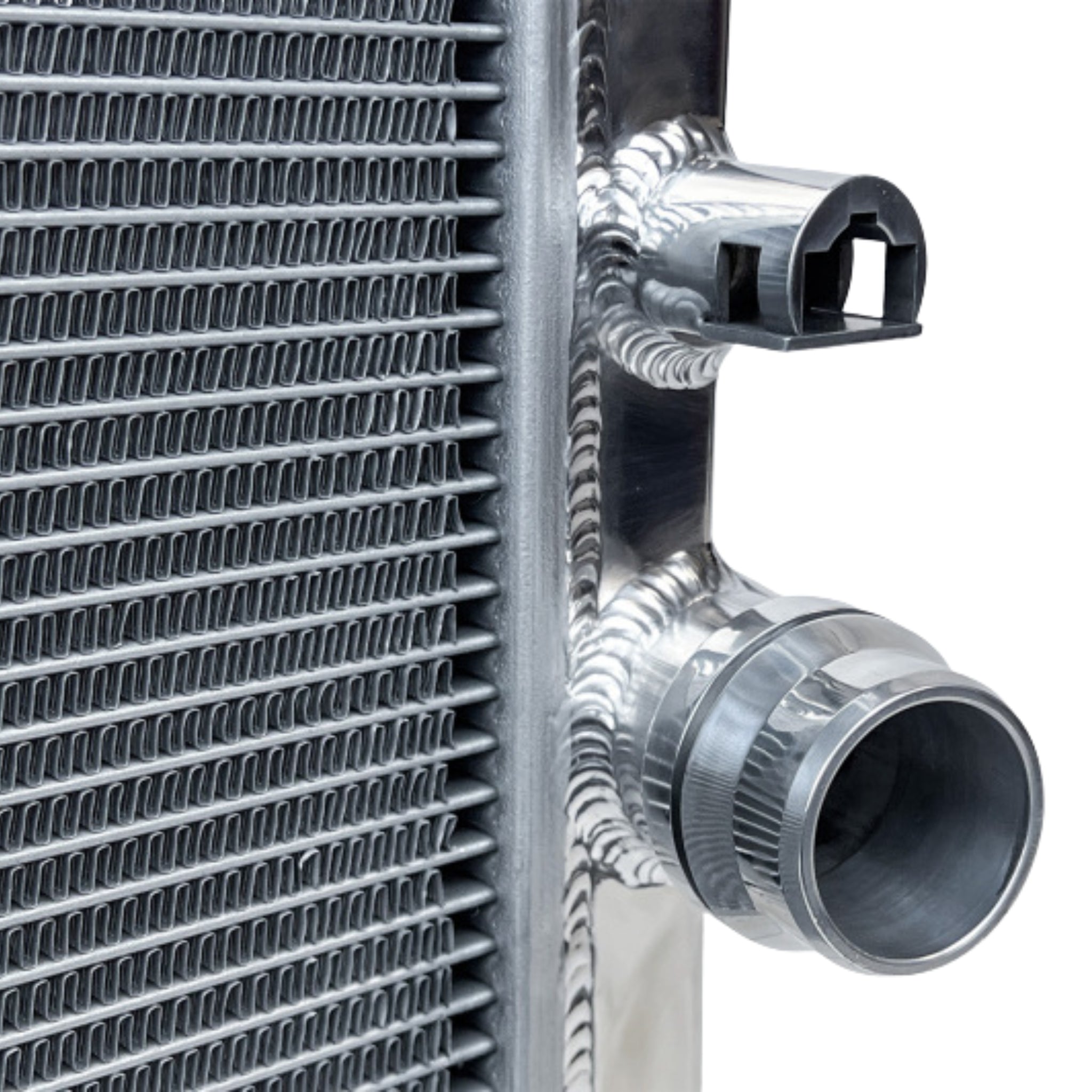 Close-up of a metallic radiator with pipes on a white background