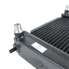Metallic radiator with visible brand logo on a white background