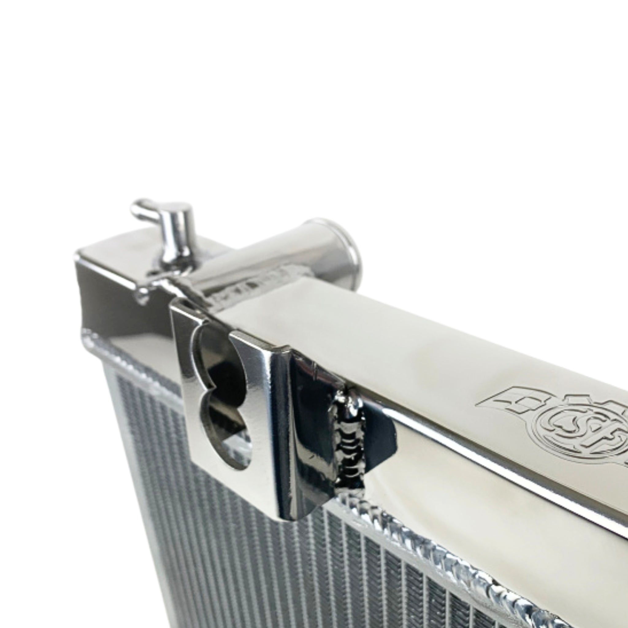 Close-up of a metallic radiator with a brand logo on a white background