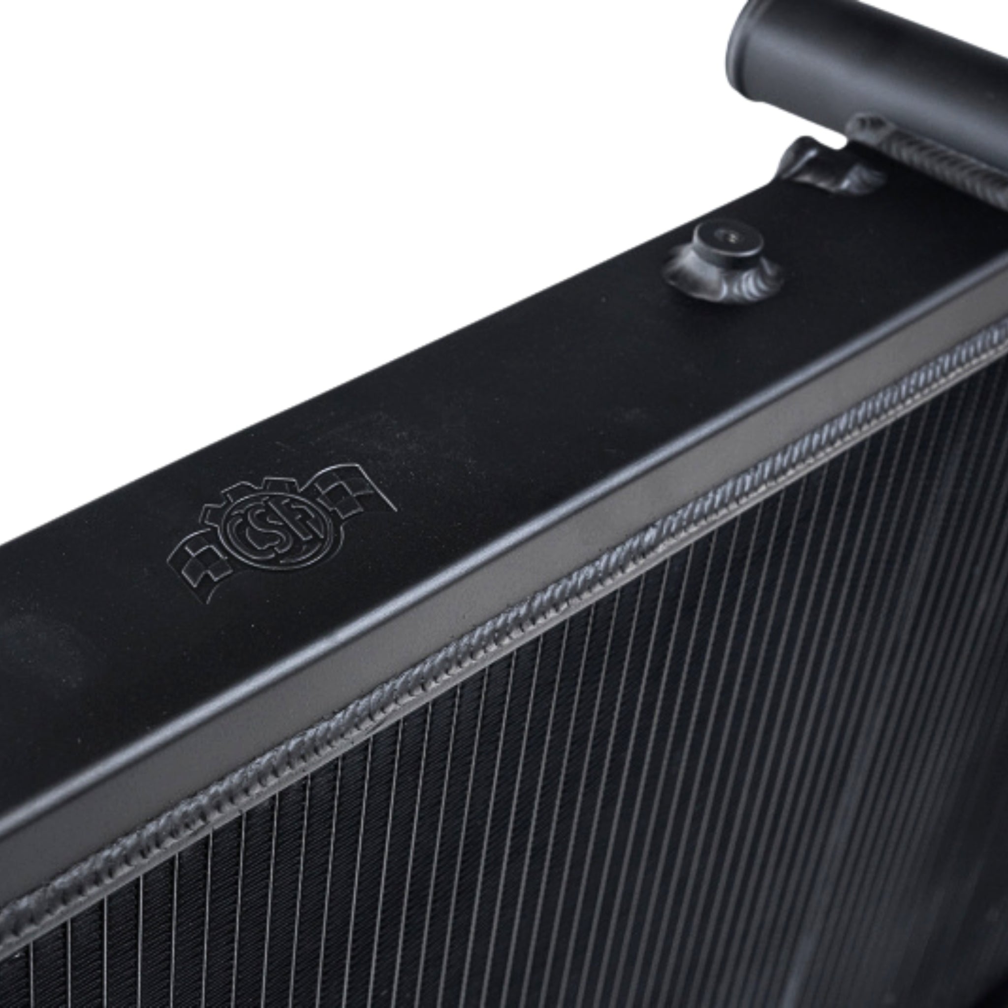 Close-up of a black radiator with a brand logo on a white background